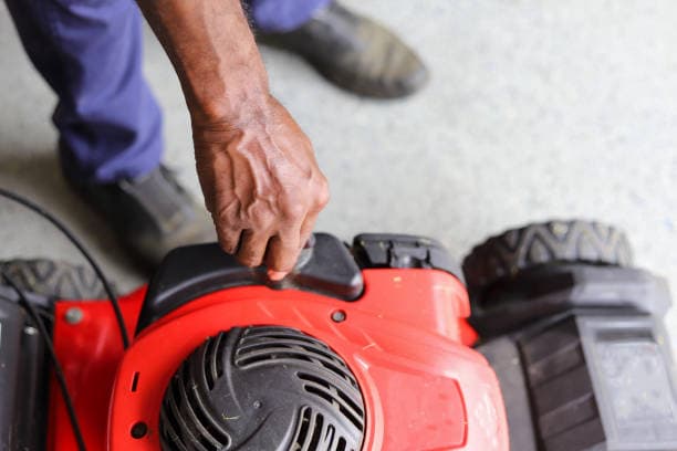 Person handling lawn equipment